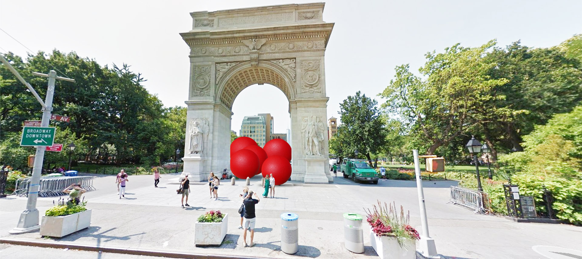 Large red balls in Washington Sq. Park arch, NY.